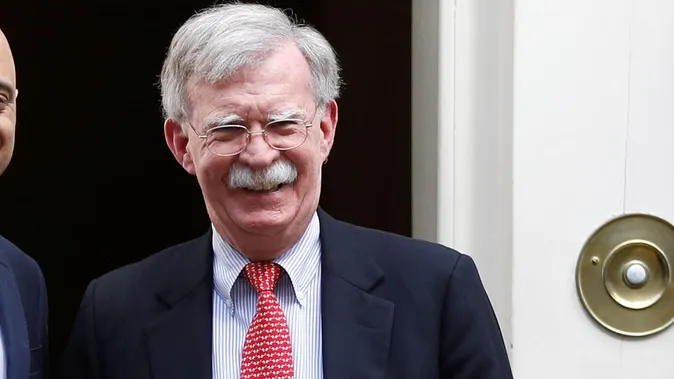 Former Trump adviser John Bolton surrenders