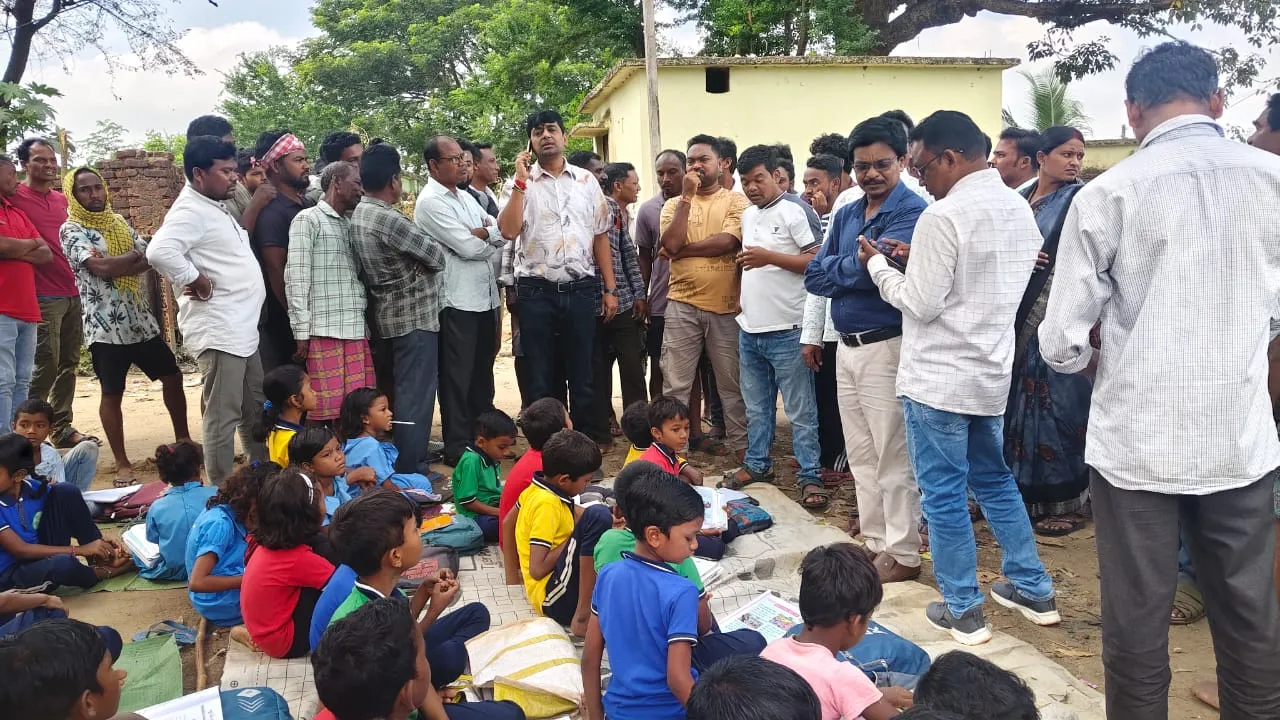 School Road Blocked: Students Sit Under Tree