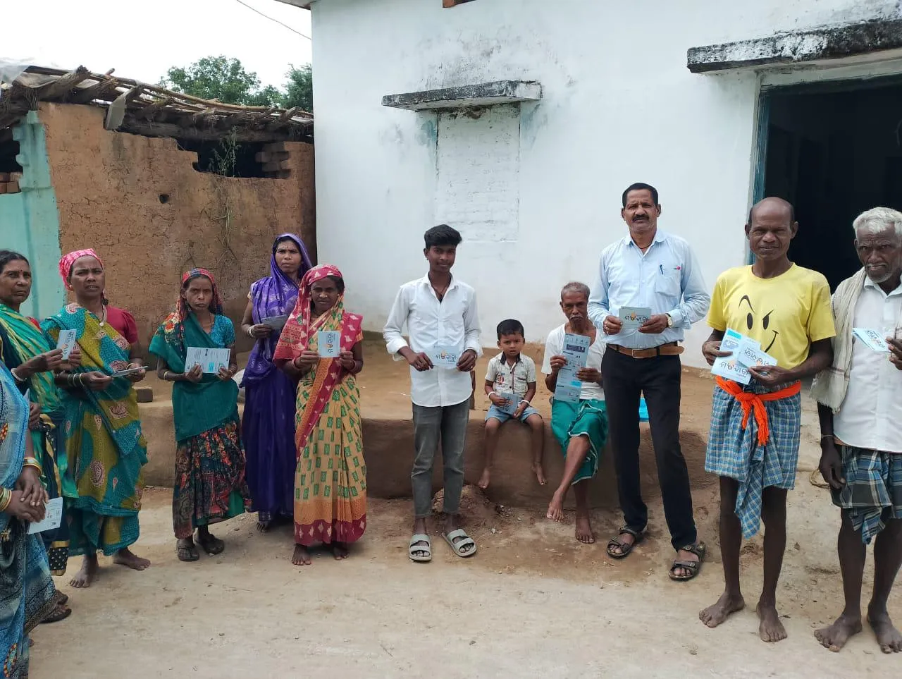 Booth-level officer distributes voter information leaflets and guidebooks in Nuapada