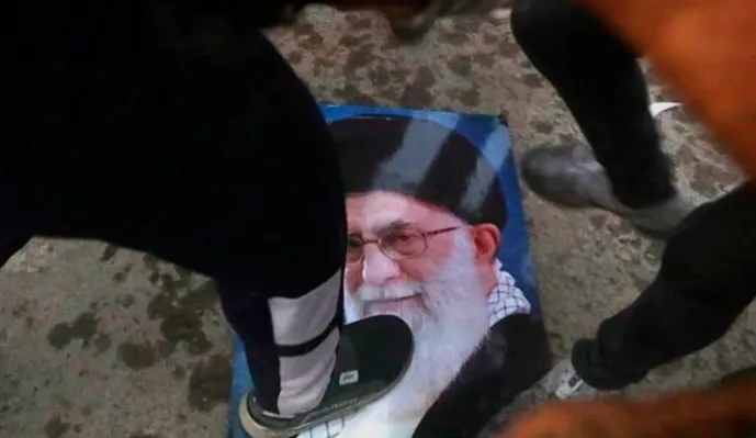 “Iranian women lighting cigarettes during protest against Ayatollah Ali Khamenei”