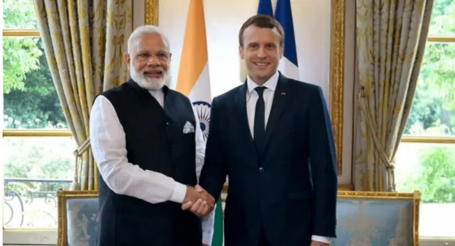 French President Emmanuel Macron with Indian officials during his official visit"